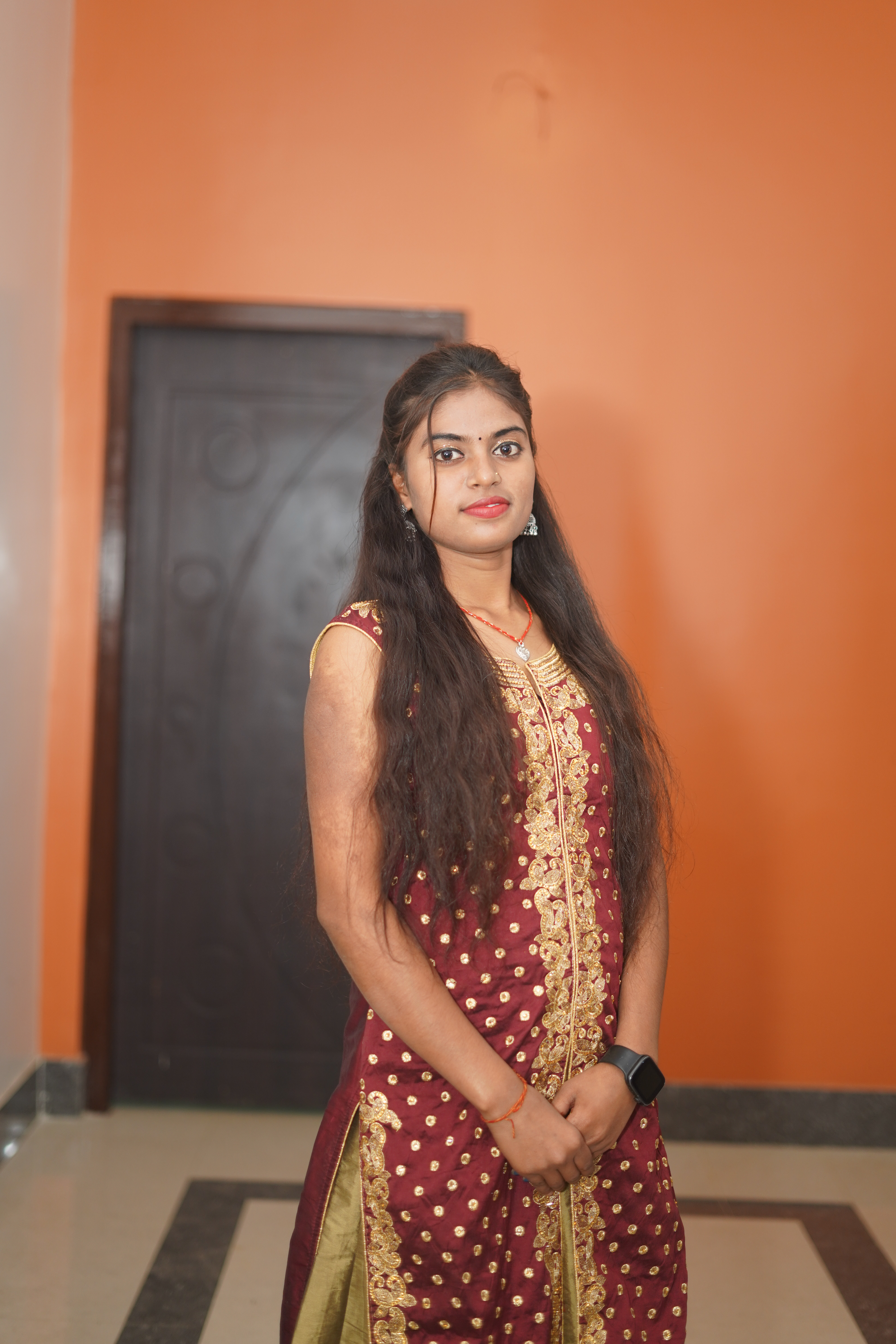 Blue digital watch on a dark liver background.